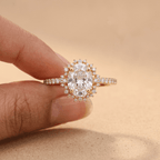 Moissanite oval sunburst halo ring on hand