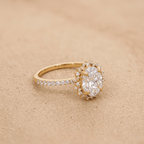 Moissanite oval cut halo sunburst side view
