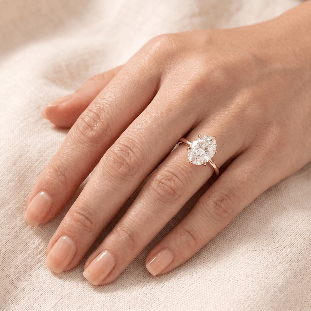 Moissanite oval engagement ring on hand