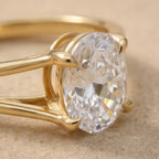 Split band oval moissanite wedding ring close-up