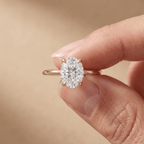 Oval moissanite bridal ring on hand