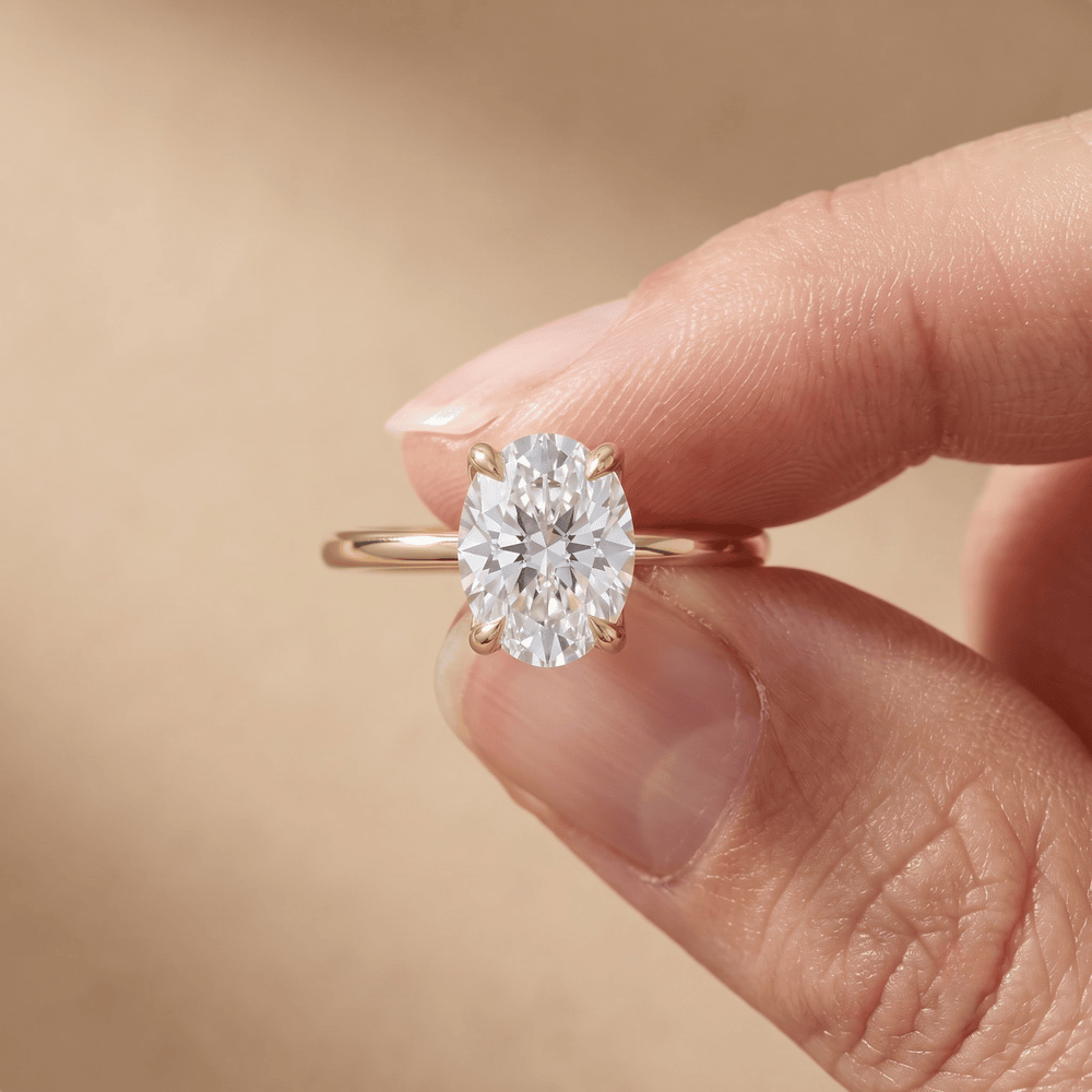 Oval moissanite bridal ring on hand