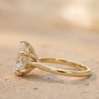 Conflict-free pear moissanite ring side profile view