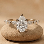 Pear cut lab diamond bridal ring in 14K gold with side stones