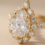14K gold shared prong ring with pear diamond
