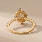 Side view of pear diamond ring shared prong