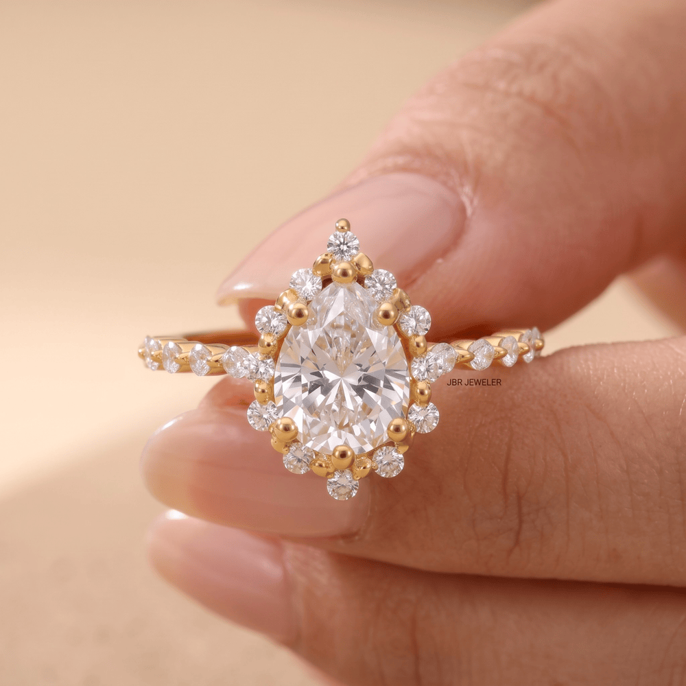 Shared prong setting on pear shaped diamond ring