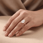 Pear cut diamond engagement ring on model's hand