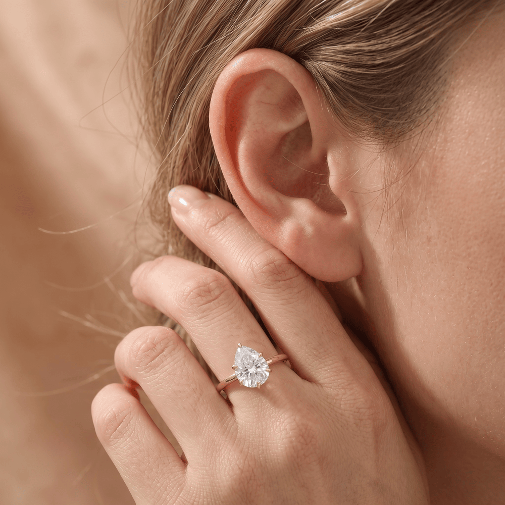 Six prong pear diamond engagement ring lifestyle photo
