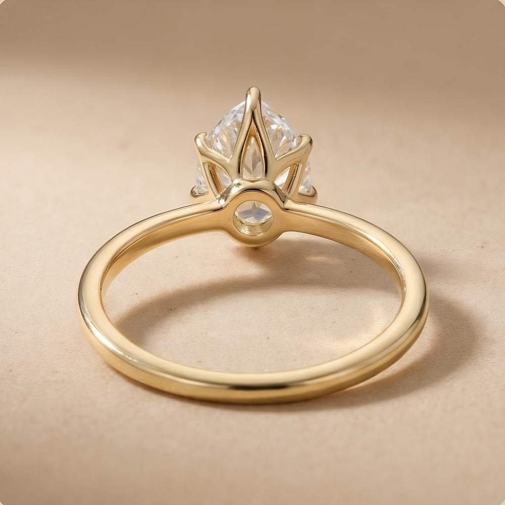 Six prong pear lab grown diamond ring top angle view