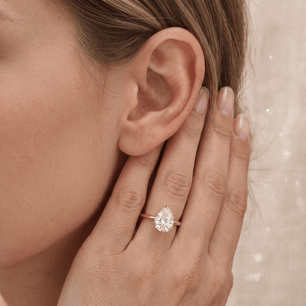 Six prong pear diamond engagement ring lifestyle photo