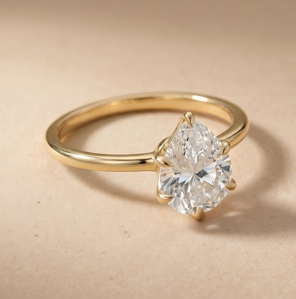 Six prong pear cut engagement ring side profile