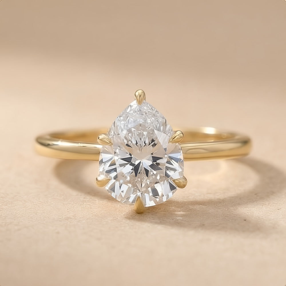 Six prong pear cut lab grown diamond engagement ring front view