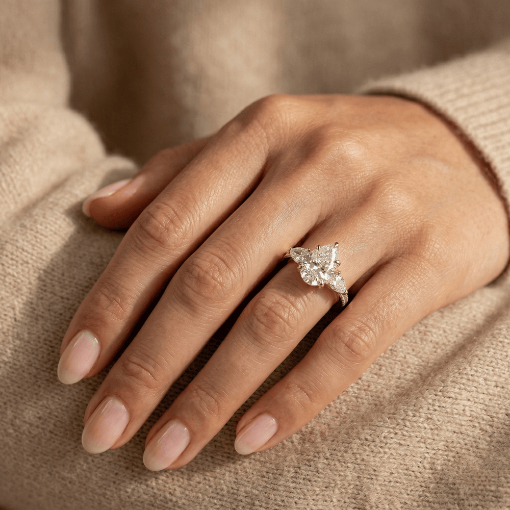 Pear lab diamond engagement ring with pavé set shoulders