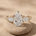 Pear lab grown cathedral pavé three stone engagement ring