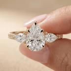 Cathedral setting pear diamond ring with pavé accents