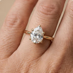 Pear cathedral hidden halo ring in white gold band
