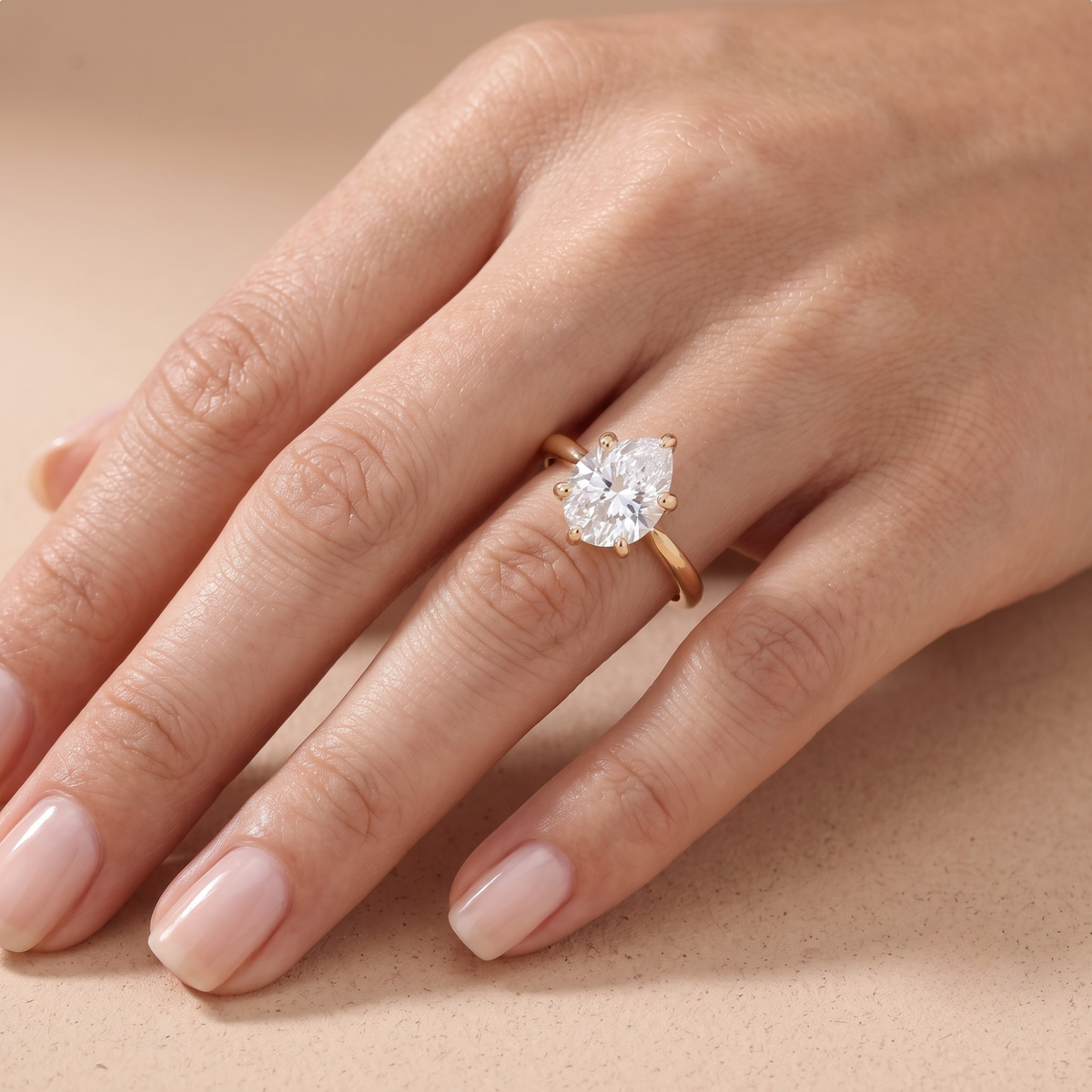 Close-up of hidden halo beneath pear cut center stone