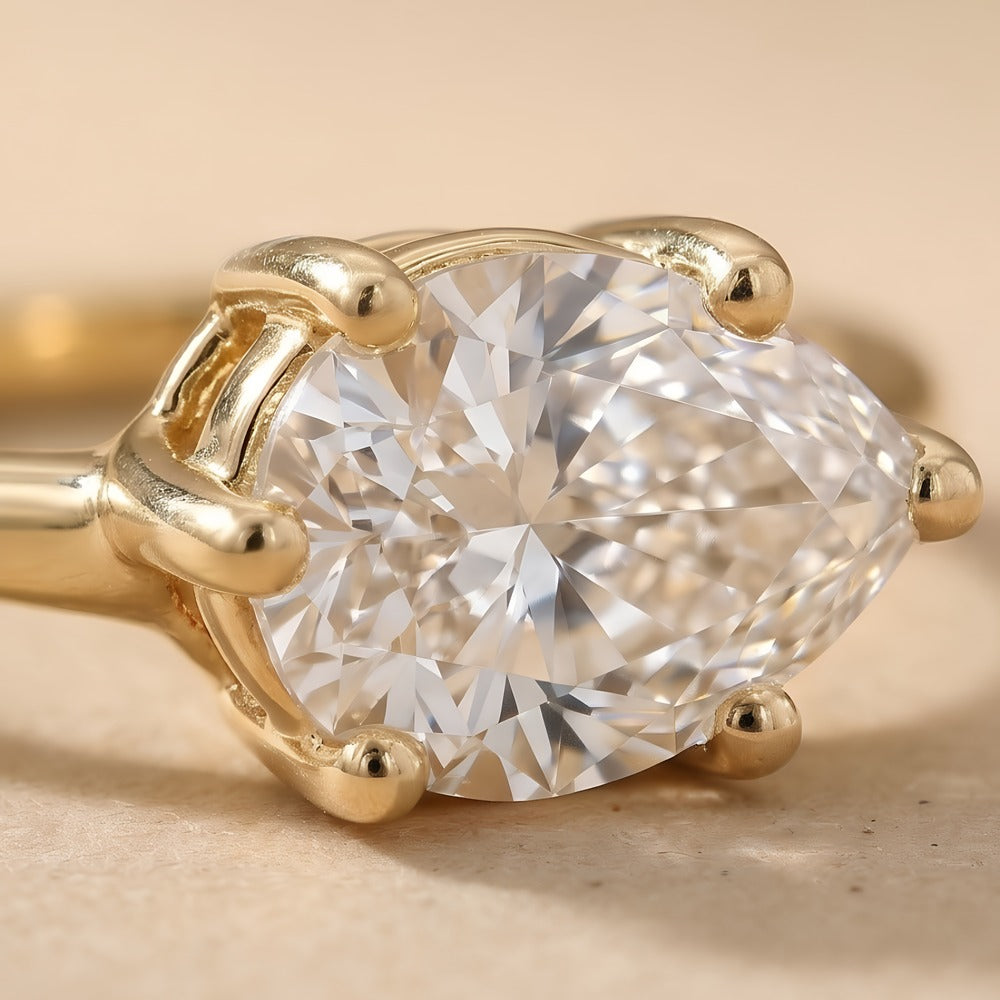 14K gold pear diamond East-West ring close-up detail