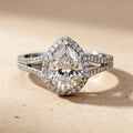 Pear lab grown diamond engagement ring with hidden halo