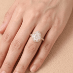 Pear shaped promise ring on model's finger