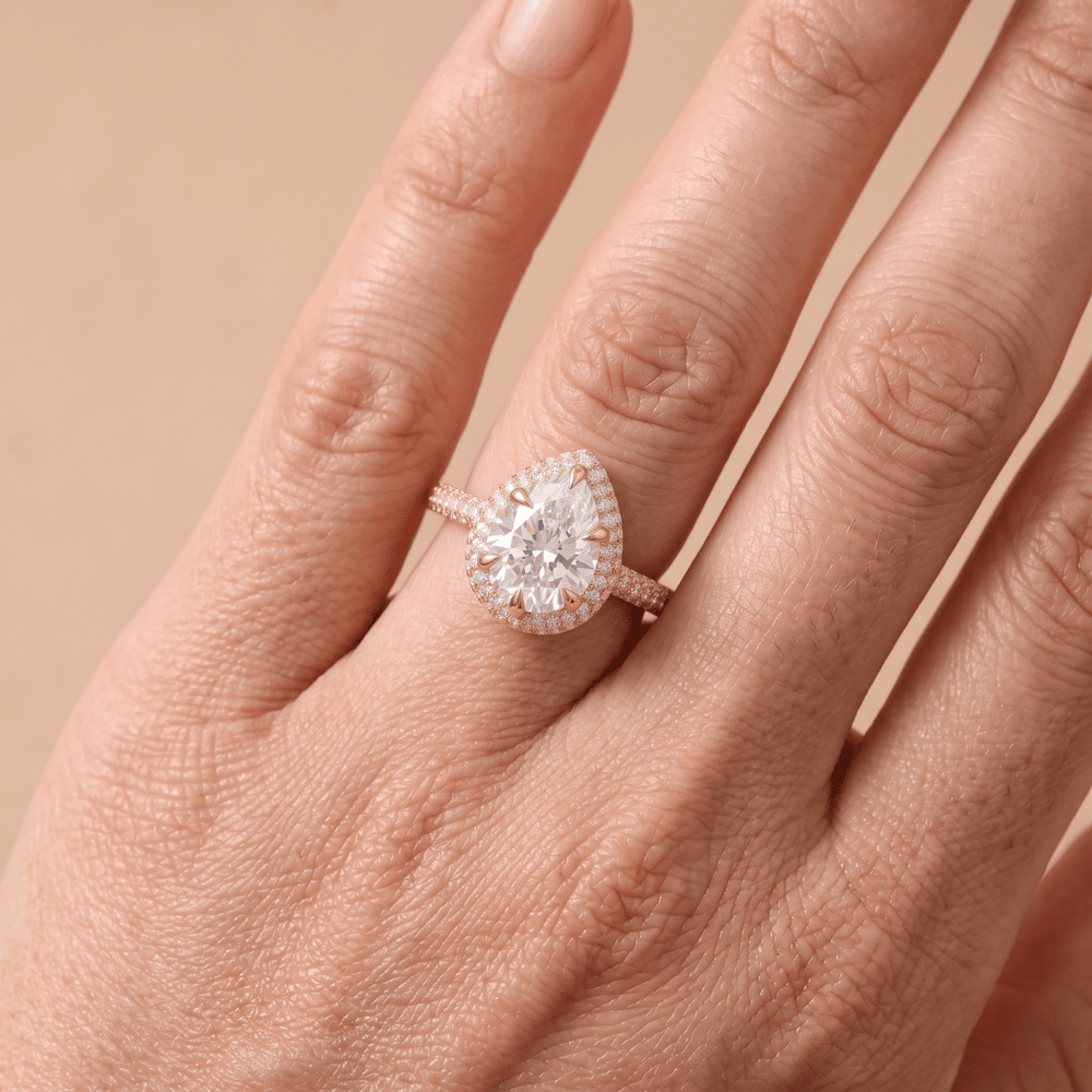 Pear shaped promise ring on model's finger