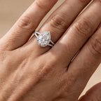 Hidden halo pear shape moissanite ring on hand