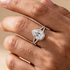 Hidden halo pear shape moissanite ring on hand