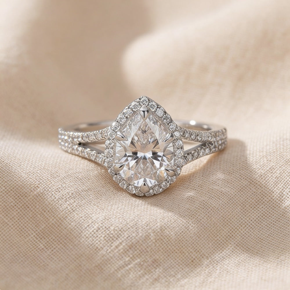Pear moissanite hidden halo engagement ring front view