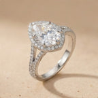 Hidden halo pear moissanite engagement ring top view