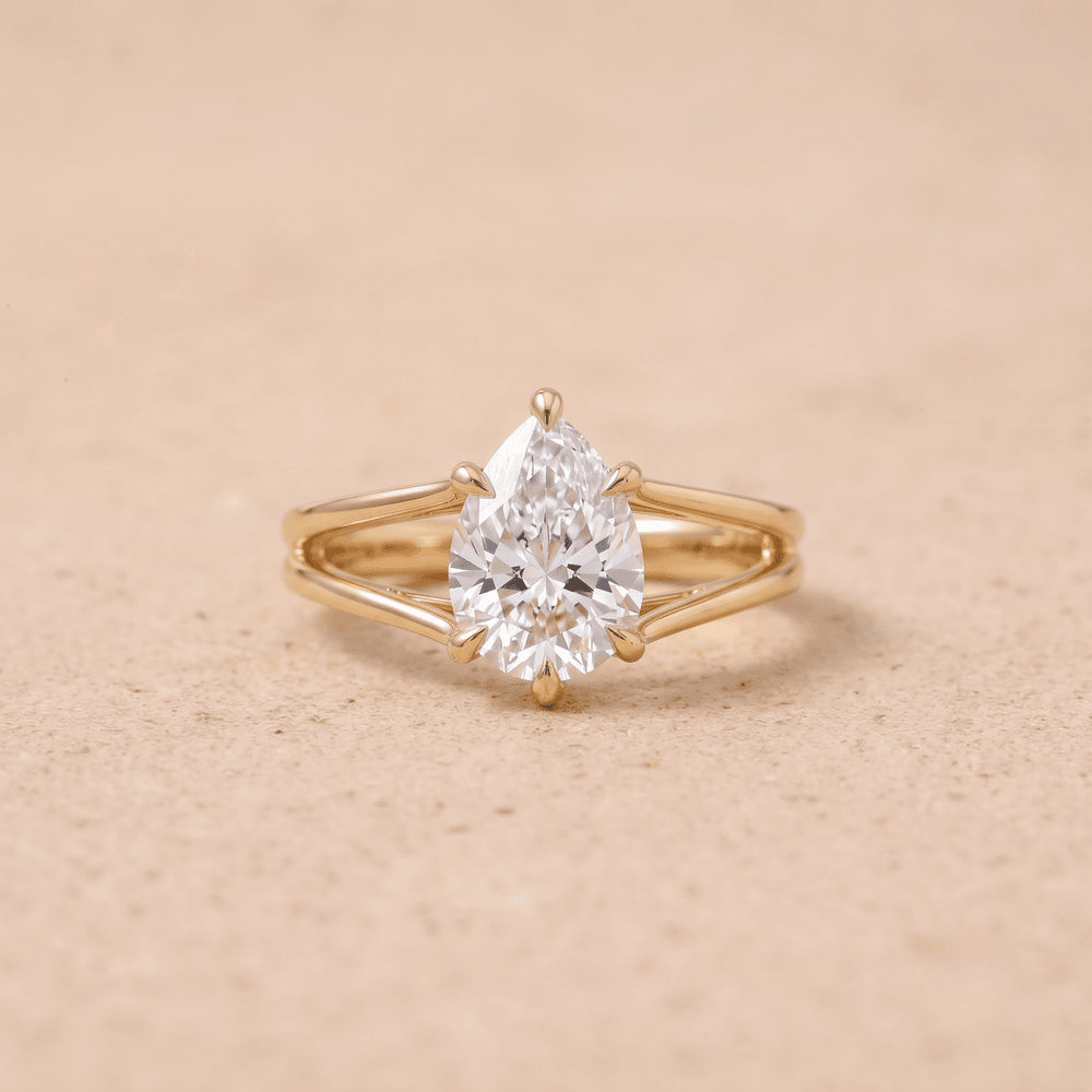 Pear cut moissanite ring 14K gold front view