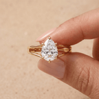 Pear moissanite ring on model's hand lifestyle shot