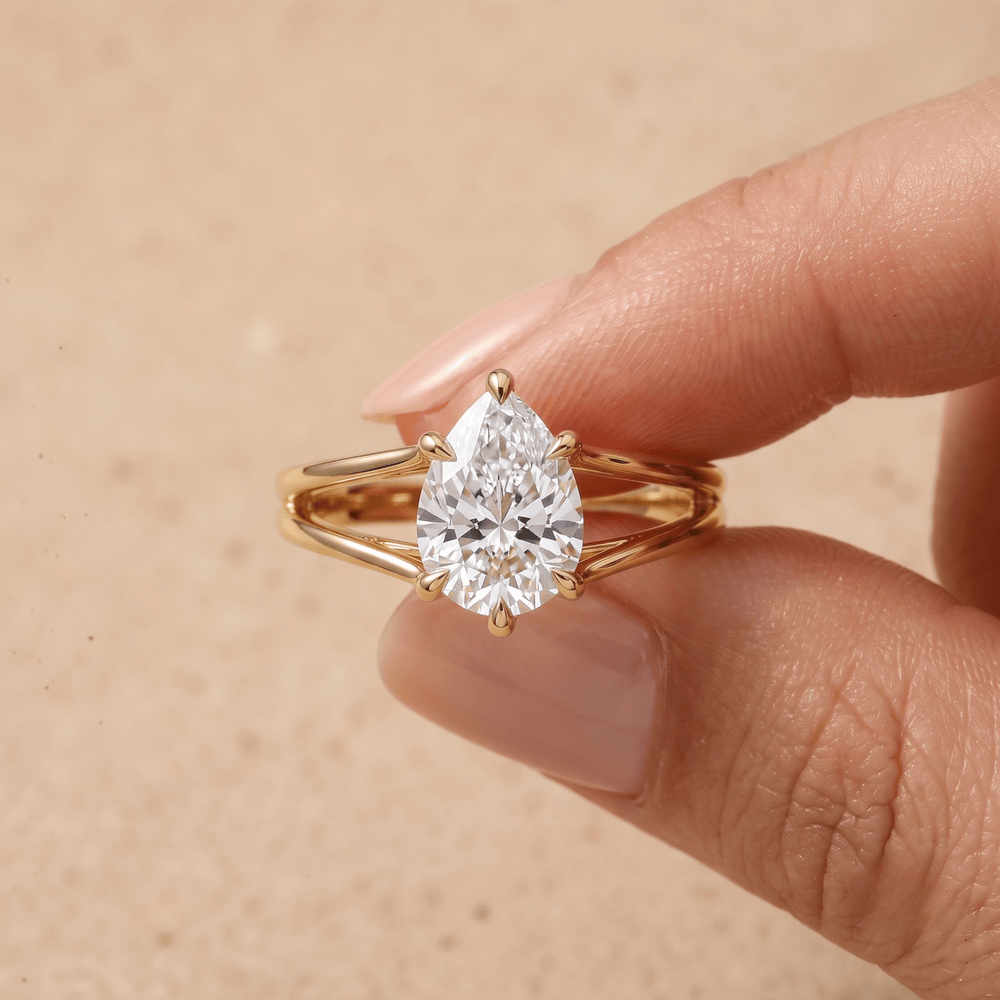 Pear moissanite ring on model's hand lifestyle shot