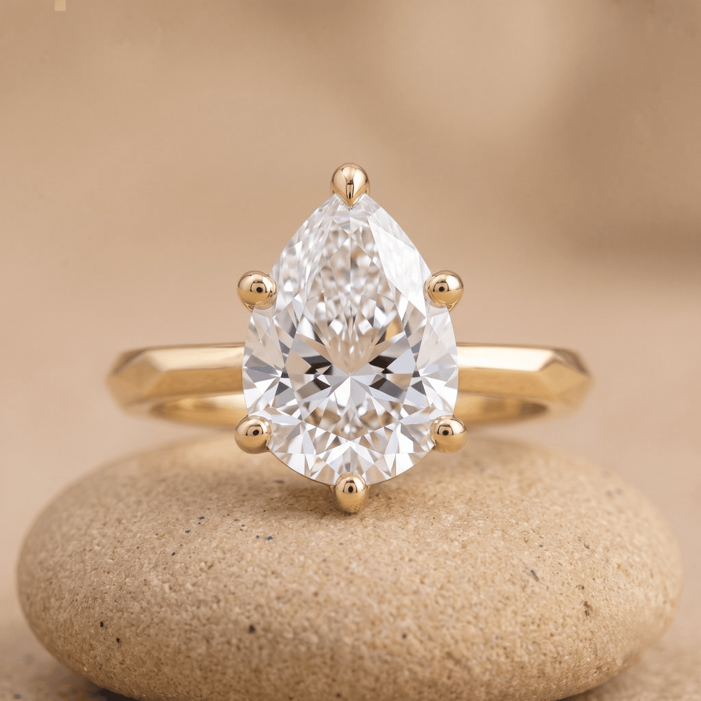 Vintage-style pear shape moissanite ring front view