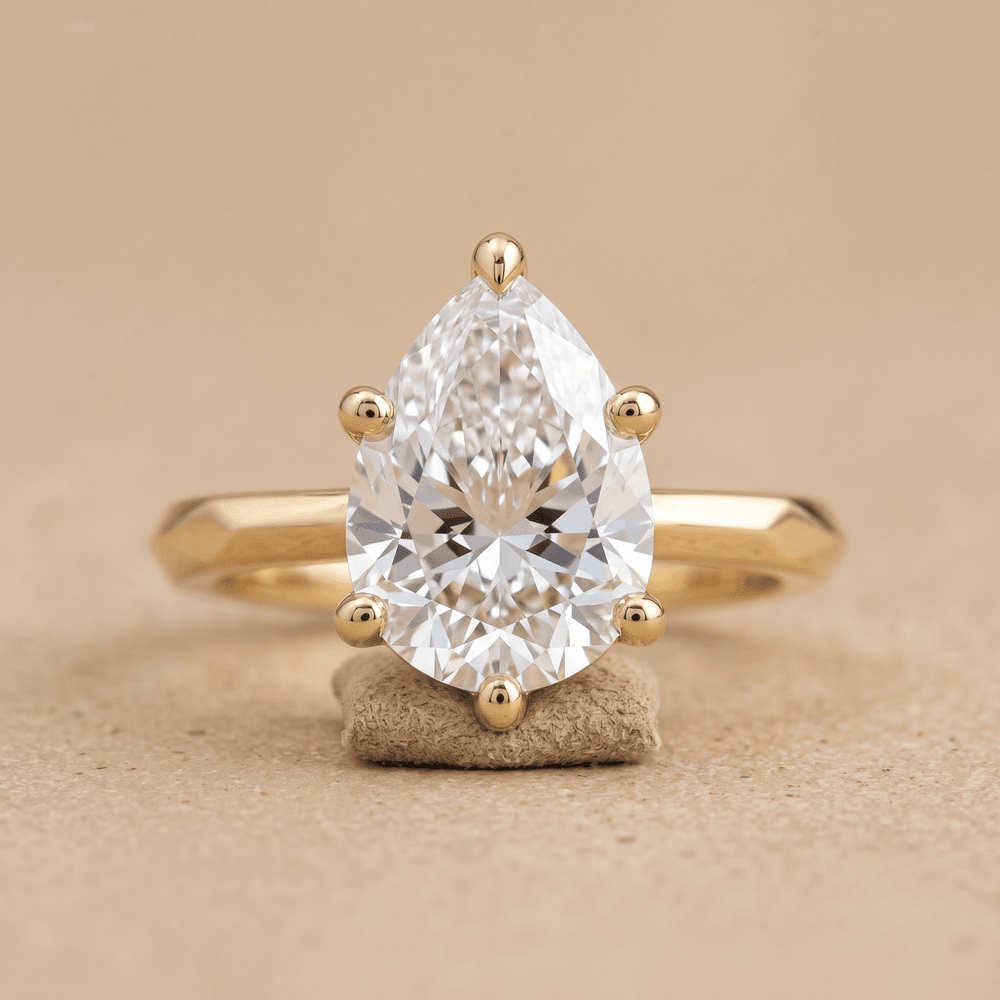 Vintage-style pear shape moissanite ring front view