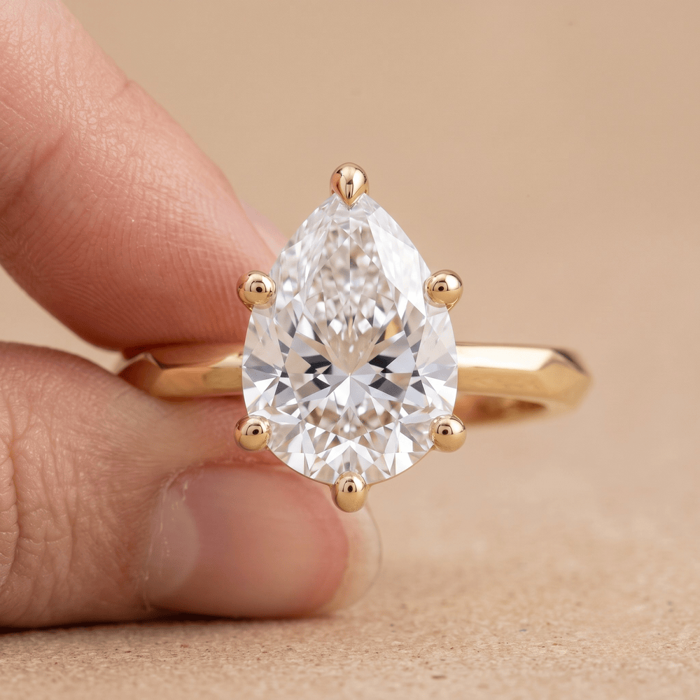 Pear moissanite ring for her on hand