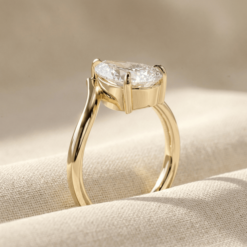 Pear shaped lab diamond promise ring in yellow gold