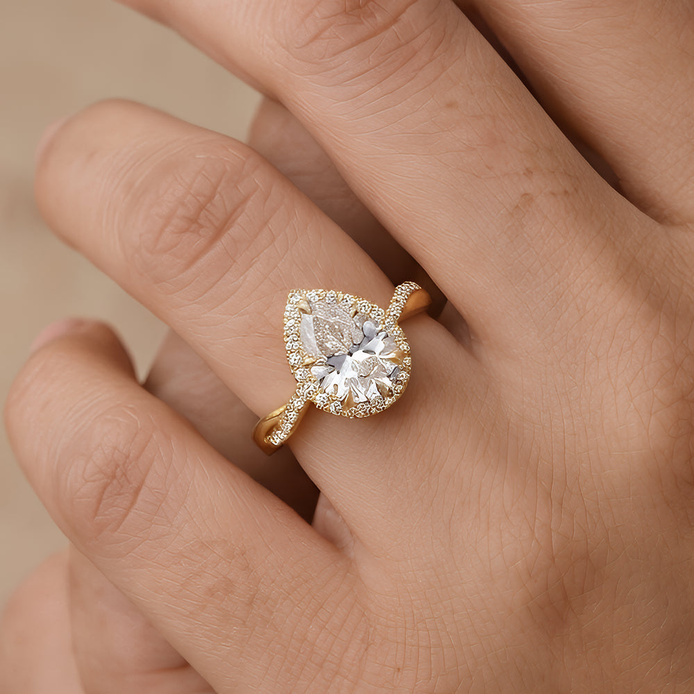 Moissanite Pear Shape Ring with Twisted Halo Setting