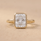 Radiant cut bezel set anniversary ring front view