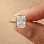 Radiant bezel anniversary ring worn on hand