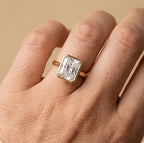 Radiant bezel anniversary ring worn on hand