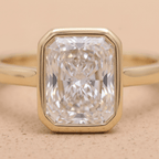 Gold bezel set radiant diamond ring close-up