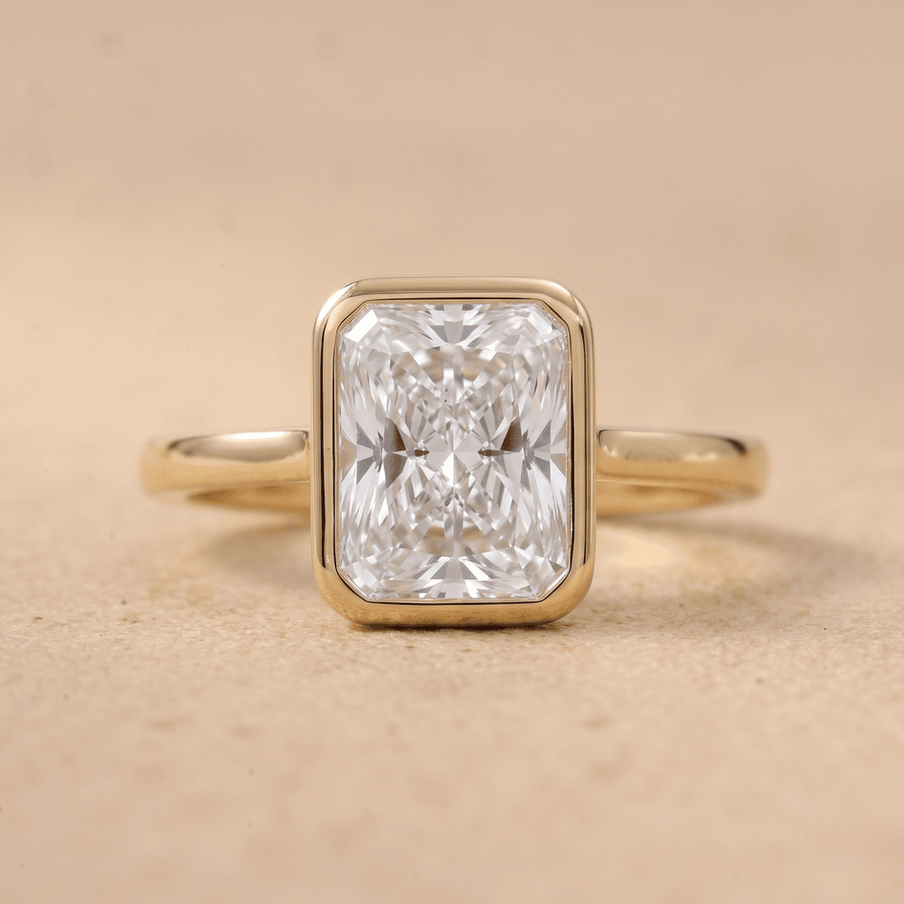 Bezel set radiant diamond promise ring front view