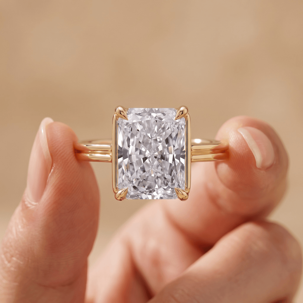 Radiant moissanite ring cathedral setting on hand