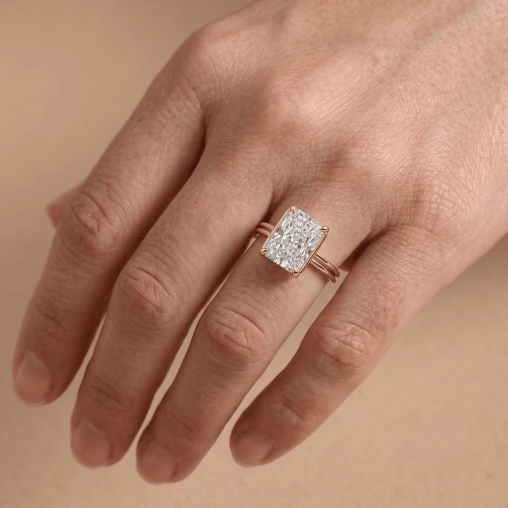 Radiant moissanite ring cathedral setting on hand Finger
