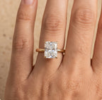 Petal radiant moissanite ring on model's hand