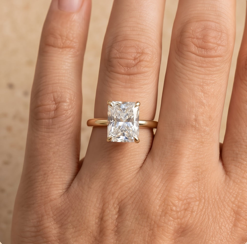 Petal radiant moissanite ring on model's hand