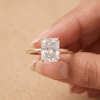 Petal radiant moissanite ring on model's hand