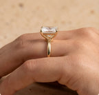 Petal radiant moissanite ring on model's hand