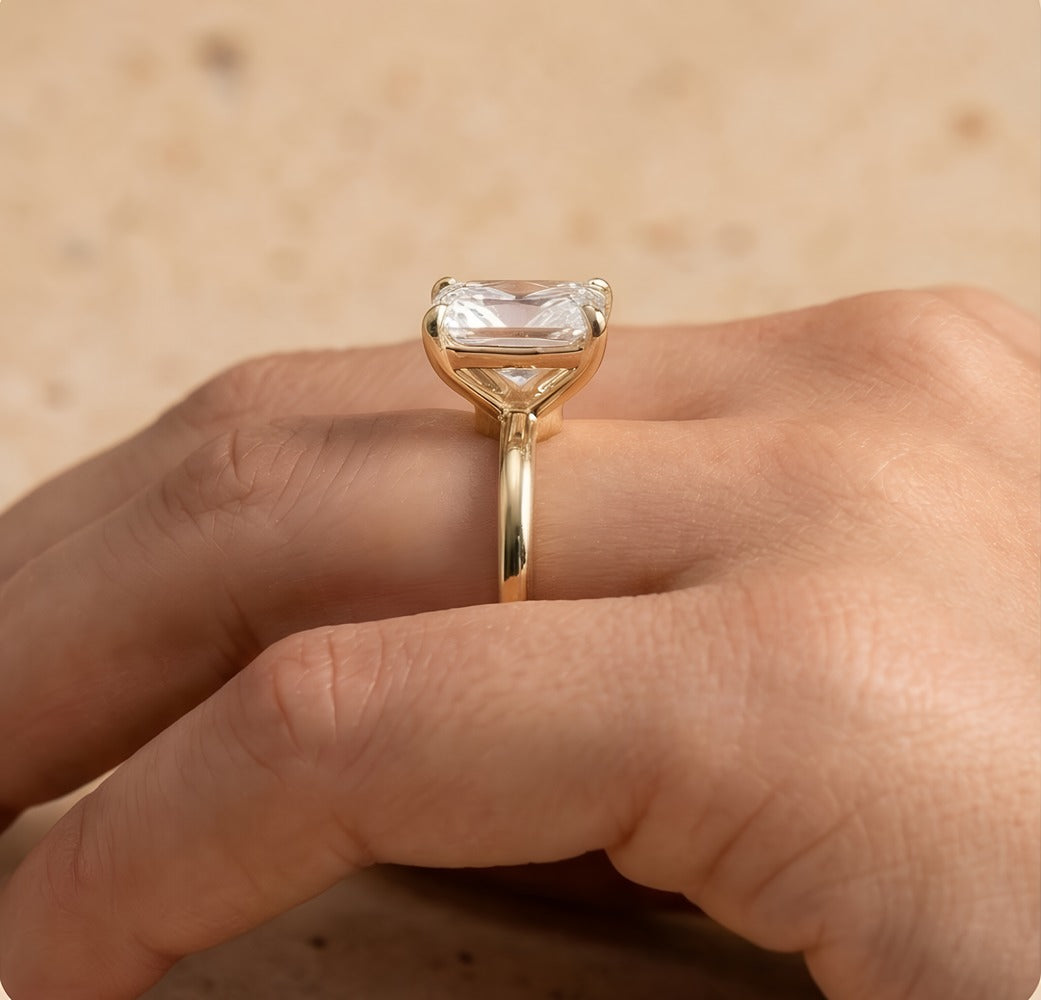 Petal radiant moissanite ring on model's hand